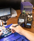 Person using Pro Grade Precision Soldering Station with Auto Calibration and Tilt Screen for micro soldering delicate electronics
