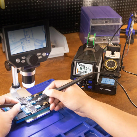 Person using Pro Grade Precision Soldering Station with Auto Calibration and Tilt Screen for micro soldering delicate electronics