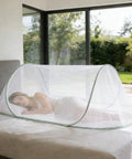 Instant Pop Up Mosquito Tent For Bedroom Camping And Patio, foldable bug net, setup on bed with breathable mesh, 77x30x23 inches.