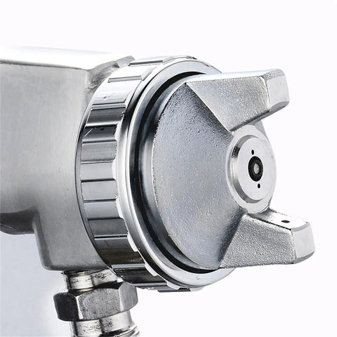 Close-up of stainless steel nozzle on Hardcore Pro Level Pneumatic Spray Gun With Slick Adjustable Valve And Killer Stainless Steel Nozzle For Smooth Auto Paint Jobs Up To 1000 Ml Capacity Tight Antiskid Grip Saves Dough On Quick Body Work Details.