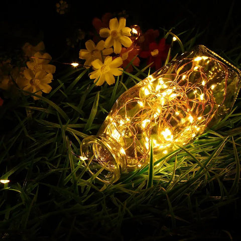 Bottle wrapped in 4 Pack 16.4 Feet 50 LED Fairy Lights Battery Operated With Remote Timer Waterproof Copper Wire Twinkle String Lights For Bedroom Indoor Outdoor Wedding Dorm Decor Warm White