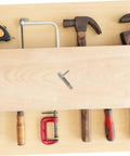 Top Shelf Stainless Steel Retractable Spring Indexing Pin For Cabinets on a workbench with various tools.