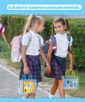 Two schoolgirls walking with backpacks holding clear PVC bags for stationery, suitable for carrying study materials.