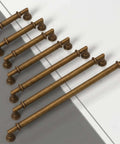 Top view of 10 Pack Antique Brass Cabinet Pulls, 3 Inch Zinc Alloy Drawer Handles For Kitchen Cupboards displayed on a surface.
