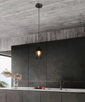 Vintage Iron Cage Pendant Light, Industrial Hanging Lamp Rustic, 47" above modern kitchen island with concrete ceiling.