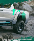 Truck with 1 Inch Front Leveling Lift Kit For Ford F 250 F 350 Super Duty 1999 2018 Black showing elevated clearance on rough terrain.