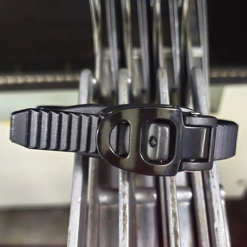 Heavy Duty Reusable Ratchet Cable Ties 12 Inch Grip Lock Straps with secure lock mechanism on metal surface.
