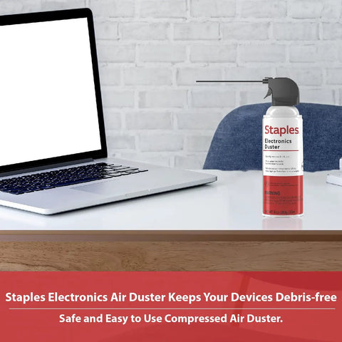Heavy Duty Compressed Air Duster For Electronics And Office Gear Dust Keyboards PCs Laptops Printers And Gaming Consoles With Moisture Free Residue Free Formula No Mess, shown beside an open laptop on a wooden desk