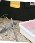 Dual Head Water Pipe Extractor And Broken Screw Remover Tool beside toolbox and storage box outdoors