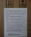 Word of Warning label on box with multilingual safety instructions for baby safety and packaging handling.