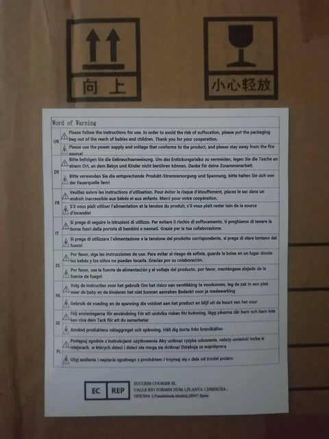 Word of Warning label on box with multilingual safety instructions for baby safety and packaging handling.