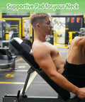 Man using bench press pad for upper back and neck support during gym workout on incline bench, protecting neck and waist.