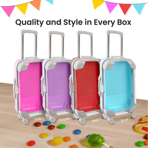 Four mini suitcase party favor boxes with wheels in pink, purple, red, and blue, 7.5x5x2.5 in for gifts and candy