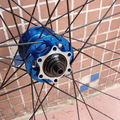 Thru Axle Conversion Kit For 15mm To 12mm And 12mm To 9mm Front Hub Adapter on blue bicycle hub
