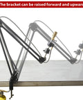 Pro Grade Propane MAPP Gas Bunsen Burner Set With Clamp Stand showing adjustable bracket movement on workbench