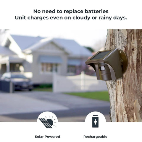 Half Mile Solar Powered Wireless Driveway Alarm With Motion Sensor attached to tree beside house