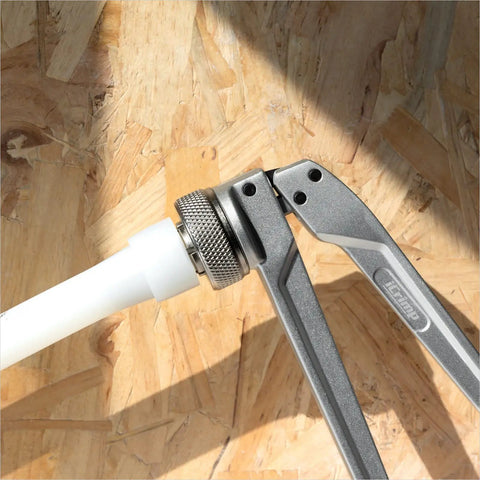 PEX Expander Tool Kit With 1/2 Inch, 3/4 Inch And 1 Inch Expansion Heads For Uponor ProPex Expansion Sleeves in use on wood surface