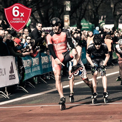 Skater finishing race with Red Magic Hardcore 2.0 Inline Speed Wheel For Road Skating 125mm Aluminum Hub X Firm Single Wheel