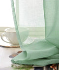 Christmas Green Semi Sheer Curtains With Linen Look Light Filtering Rod Pocket Panels for Bedroom and Living Room close-up view