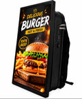 Turn Heads With This Dope 21.5 Inch Advertising Backpack Featuring Bright HD LCD Panel And IP65 Waterproof Digital Signage Running Smooth Android OS For Creative Mobile Campaigns On The Go showing delicious burger ad.