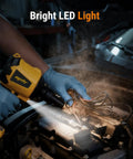 Cordless Air Duster And Blower Tool Only With 50,000 RPM Brushless Motor in use under car hood with LED light highlighting wires.