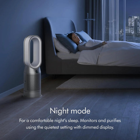 Night mode of Hot And Cool HP07 Air Purifier With Heater And Fan next to a bed, fully sealed HEPA H13 filtration in a dark room