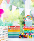Birthday Gift Bags Set Of 2 Large 16 Inch Gift Bags With Handles Includes Matching Tissue Paper Cards And Stickers next to rainbow cake