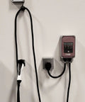 Top Shelf EV Charger Cord Retractor Keeps Your Charge Wire Locked Down And Beat Up Proof No Fuss Garage Setup Heavy Duty Wall Mount Bracket For J1772 Plugs Smooth Glide Action with mounted cords.