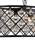 Modern Seven Light Crystal Pendant Fixture With Slick Polished Nickel Finish And Handcrafted Clear Sphere Globes For Dining Rooms, close-up view.