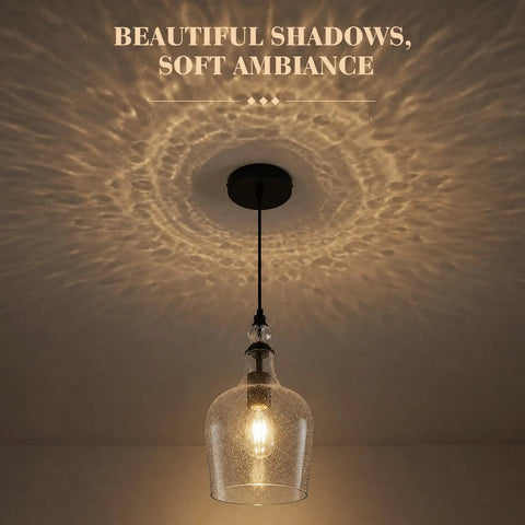 BNHHLZ Seeded Glass Pendant Light for Kitchen Island, Matte Black Teardrop Hanging Light Fixture, Adjustable Cord in action, creating ambiance.