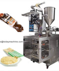 Heavy Duty Automatic Piston Pump Liquid Filling Machine For Honey Jam Jar Bottle Lotion And Tomato Paste Boasts A No Sweat Design And Delivers Killer Fluid Transfer, showing machine with honey jar and paste.