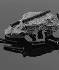One Quarter Twenty Button Head Socket Cap Bolts Set Built To Last 20 Pcs 304 Stainless Steel With Black Oxide Finish displayed on rock
