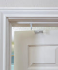 Close-up of top mount latch of Straight Up Secure Metal Child Safety Door Lock For Ultimate Home Security, white color.