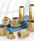Top Shelf Pure Brass Hollow Rivet Eyelets For Leather And Heavy Duty Fabric Crafting Secure Fastener Clips Smooth Grommet Assortment 200 Pieces, view of brass rivet eyelets in various sizes on a blue background.