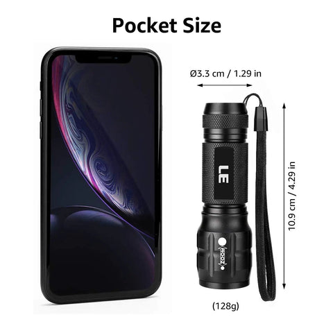 Compact LED Flashlight With Ultra Bright Output Waterproof Build Adjustable Focus For Outdoor Adventures And Emergency Use AAA Batteries Included Handy Pocket Size great for camping tactical gear next to smartphone