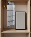 Rock Solid Four Layer Closet Hanging Shelf With Sturdy Hook Nonwoven Mesh Bag Organizer Space Saver with deep compartments.