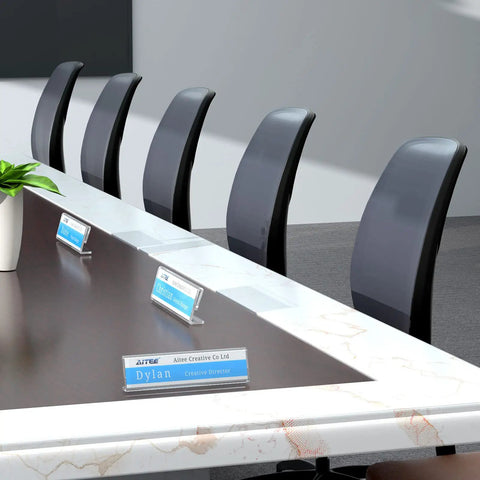 Clear Desk Name Plates Set Of 12 Personalized 2x8 Inch Sign Holders for table displays at office conference.