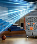 Top Shelf Heavy Duty Portable Evaporative Air Cooler With Six Blade Turbine And 3000W Motor providing cool air in a gymnasium setting.