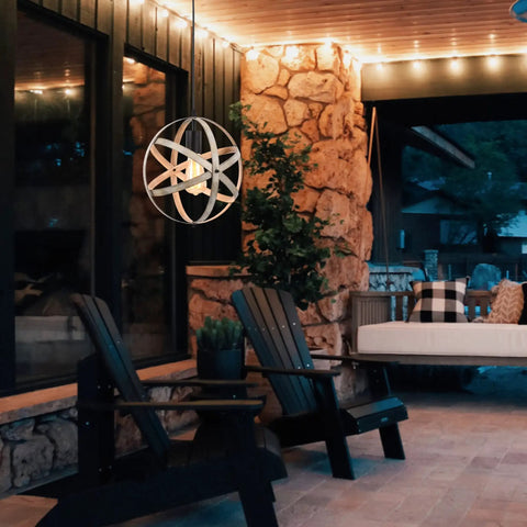 Outdoor view of industrial spherical pendant light with changeable cage design, 15 ft cord, ash wood finish in cozy setting