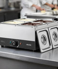 Heavy Duty Commercial Chocolate Melting Machine, Four Tank Water Bath Heater on a kitchen counter with stainless steel tanks.