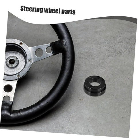 Racing Car Steering Wheel Adapter Plate And Riser Spacer For Pro Grade Control And Comfort shown on a gray surface.