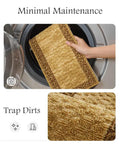 Hand placing yellow stair carpet mat into washing machine, showcasing minimal maintenance of Non Slip Stair Treads For Wood Steps.