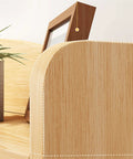 Close-up of Rock Solid Electric Standing Desk L Shaped Computer Workstation with smooth rounded edges and wood grain finish.