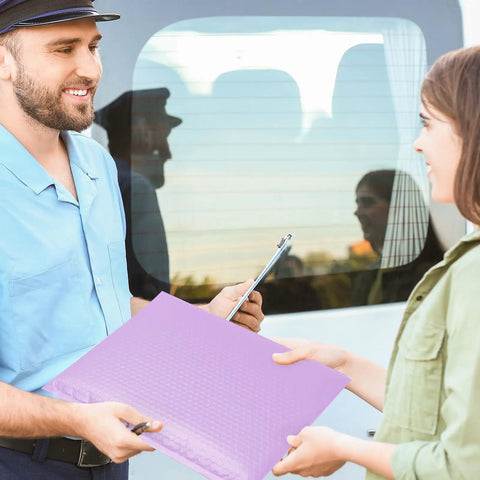 Delivery person handing over Big Ol Lavender Bubble Mailers 12x15 Inch 40 Pack Waterproof Padded Envelopes to woman