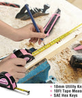Person using pink 10ft tape measure and utility knife from Pink 35 Piece Tools Set With Storage Toolbox For Home Garage Dorm And Apartment Essential Tool Kit For New House Projects And Back To School Prop 65 Safe Pink Ribbon Supports Helping Women Now on wooden plank.