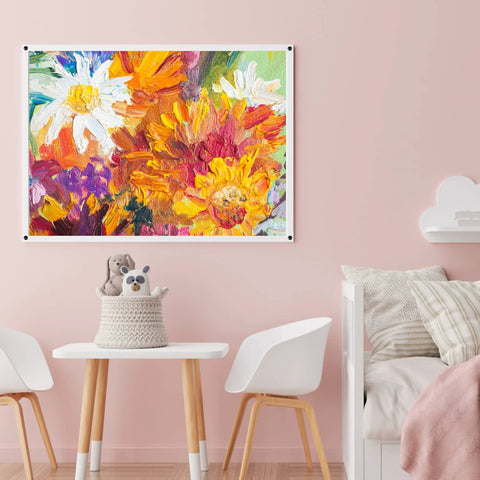 Colorful floral painting on wall above a child's play area with table, chairs, and soft toys in a pastel pink room.