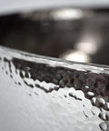 Close-up of the Knockout Round Vessel Bathroom Sink 15 Gauge Hand Hammered Copper Polished Nickel Finish showing textured surface.