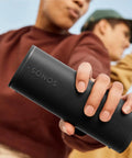 Person holding Ultra Compact Waterproof Bluetooth Speaker With 10 Hour Battery IP67 Dustproof And Waterproof Outdoor Ready Precision Drivers.