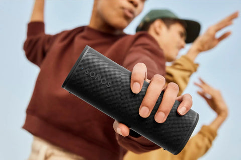 Person holding Ultra Compact Waterproof Bluetooth Speaker With 10 Hour Battery IP67 Dustproof And Waterproof Outdoor Ready Precision Drivers.