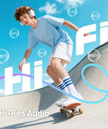Young boy skateboarding with headphones, visuals of music formats, representing Kid Friendly MP3 Player With Bluetooth And WiFi 4 Inch Screen Music Player With Parental Controls Spotify Kids Compatible Expandable To 512GB Black Ideal For Long Trips And Busy Parents Great For Music Learning And Screen Time Balance.